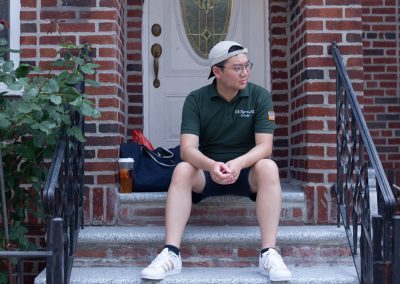 Rayson Relaxes in front of his home in Bensonhurst